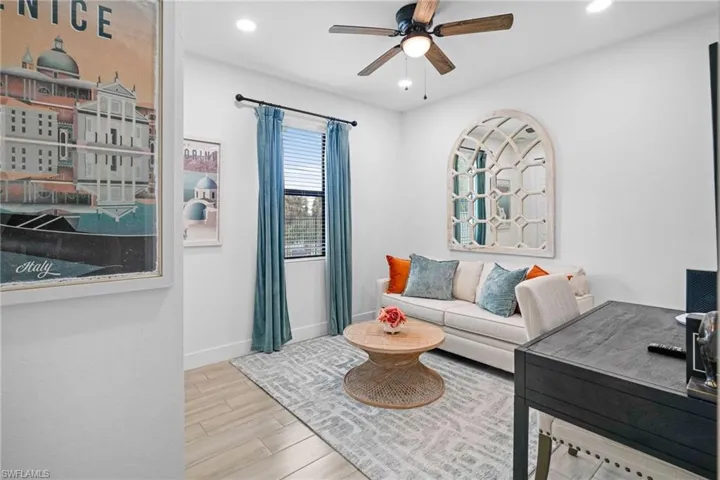 Office featuring light wood finished floors, recessed lighting, and a ceiling fan