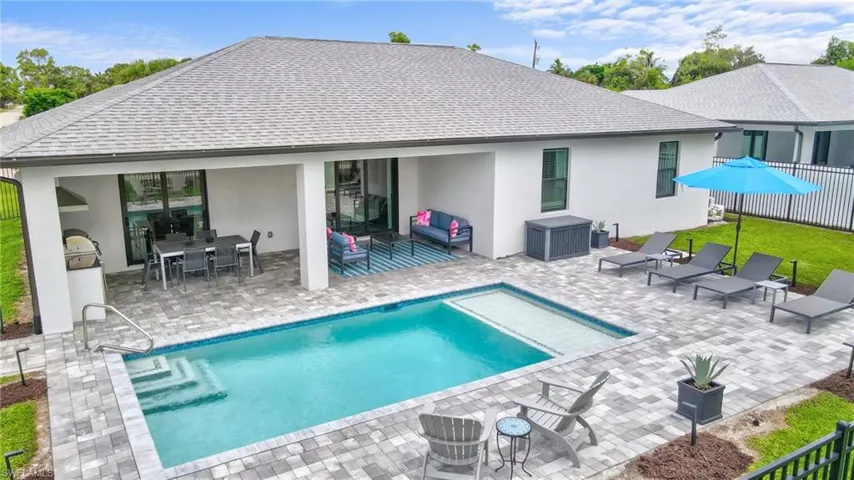 Rear view of property with a patio area, stucco siding, outdoor dining area, roof with shingles, and outdoor lounge area