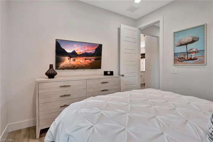 Bedroom with baseboards and light wood-style floors
