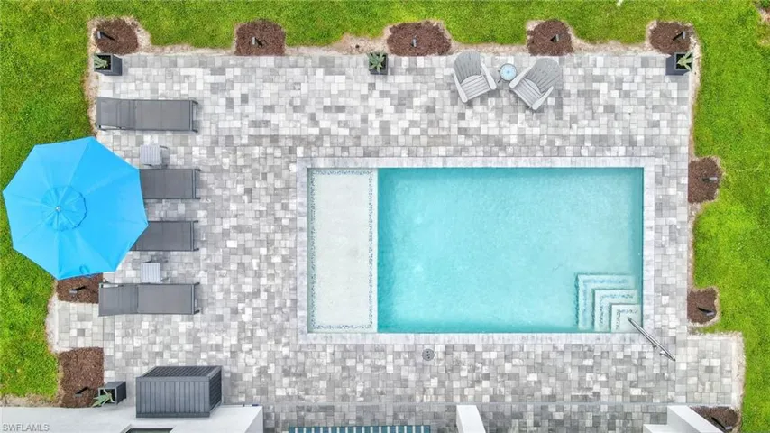View from above of property featuring a pool area