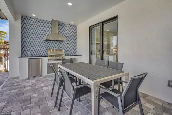 View of patio / terrace with exterior kitchen and outdoor dining area