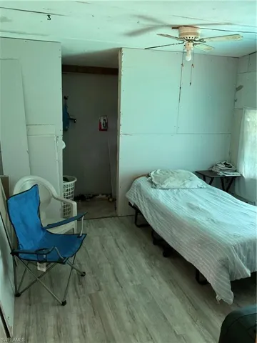 Bedroom with light wood-type flooring and ceiling fan