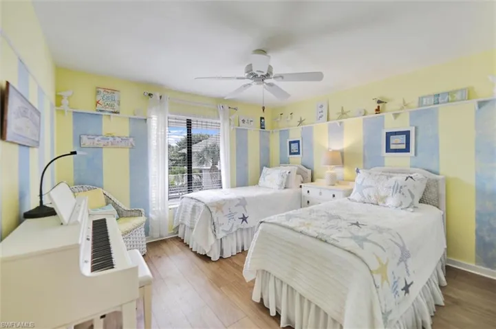 Bedroom featuring hardwood / wood-style flooring and a ceiling fan