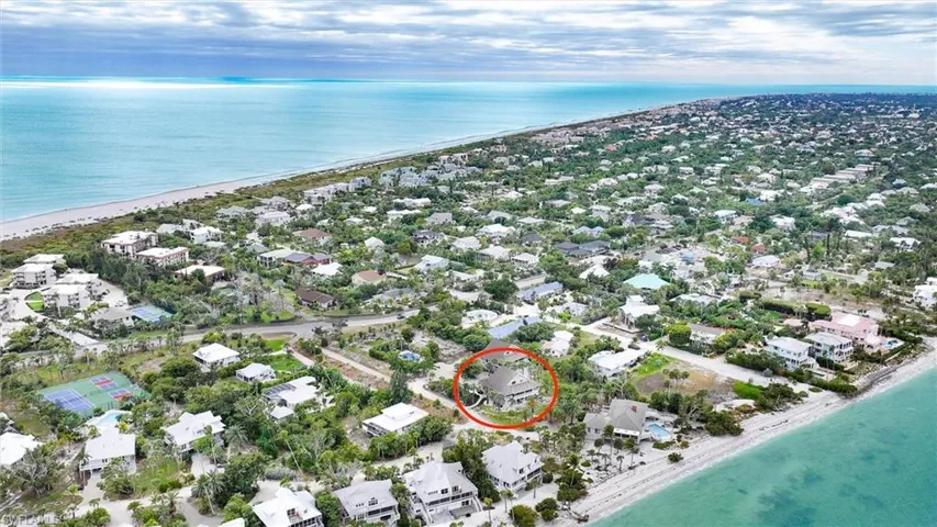 Aerial view of property's location with nearby suburban area