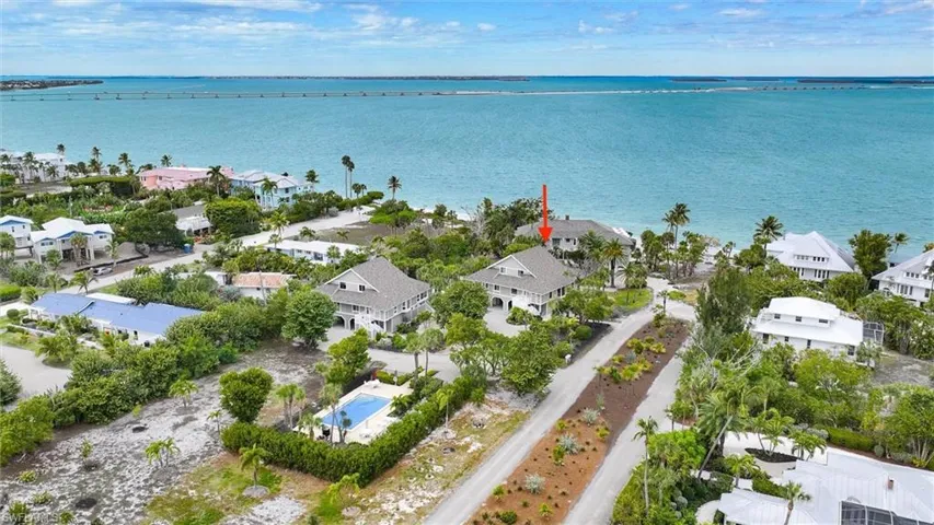 Aerial perspective of suburban area featuring a large body of water
