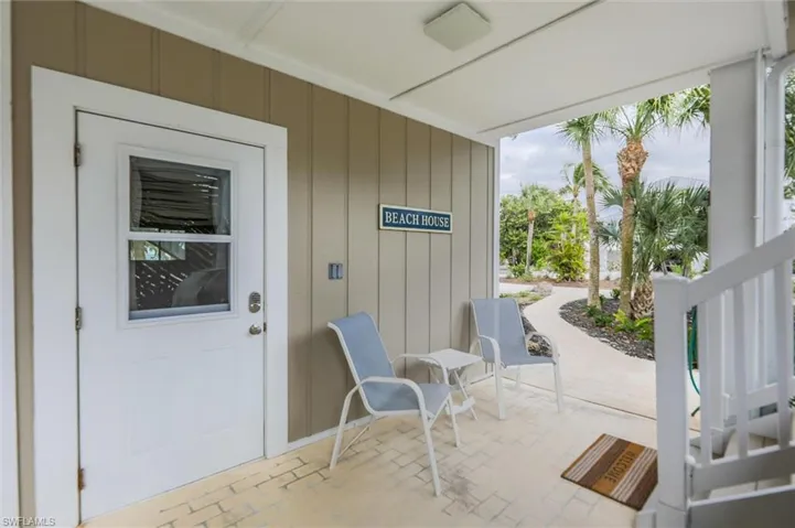 Property entrance with covered porch