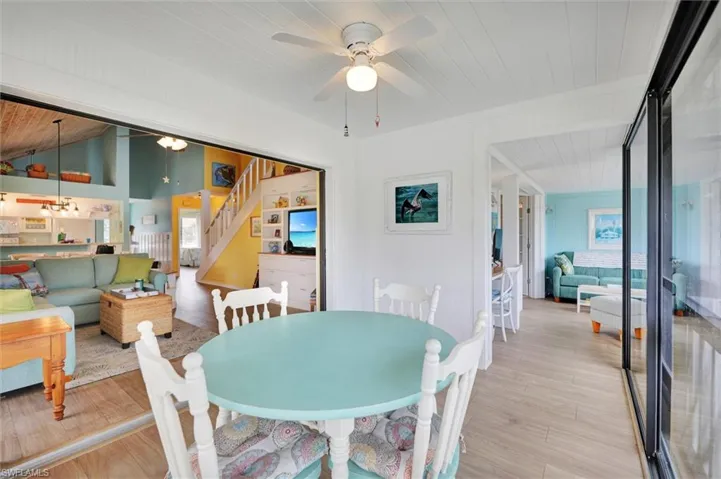 Dining area featuring wooden ceiling, ceiling fan, and light wood-style floors