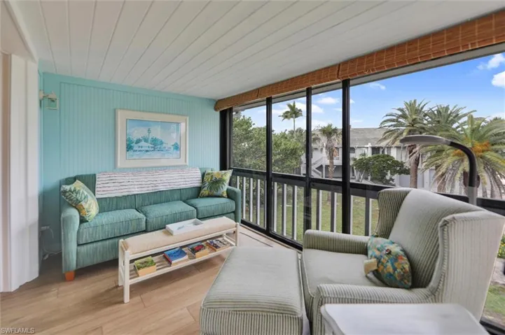 Sunroom / solarium featuring wooden ceiling and wood finished floors
