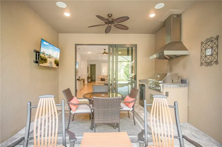 Take advantage of the outdoor kitchen and dining - enjoy the Florida weather