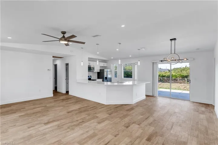 Kitchen with visible vents, appliances with stainless steel finishes, light countertops, and light wood-style floors