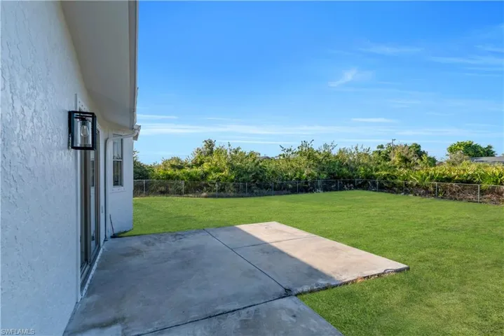 View of yard with a patio area and a fenced backyard