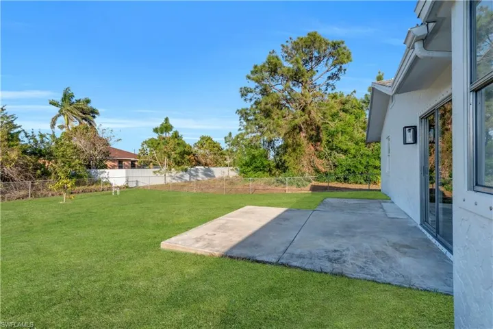 View of yard featuring a patio area and a fenced backyard