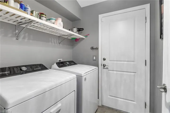 Clothes washing area featuring washer and clothes dryer