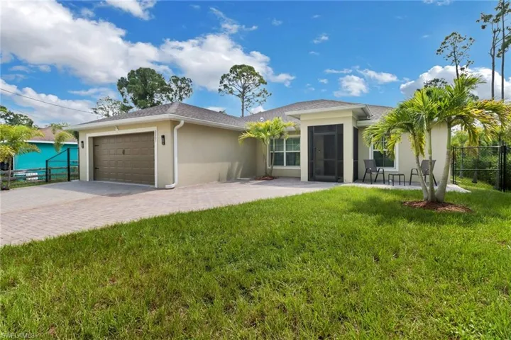 Fully fenced. Front facade with a garage.