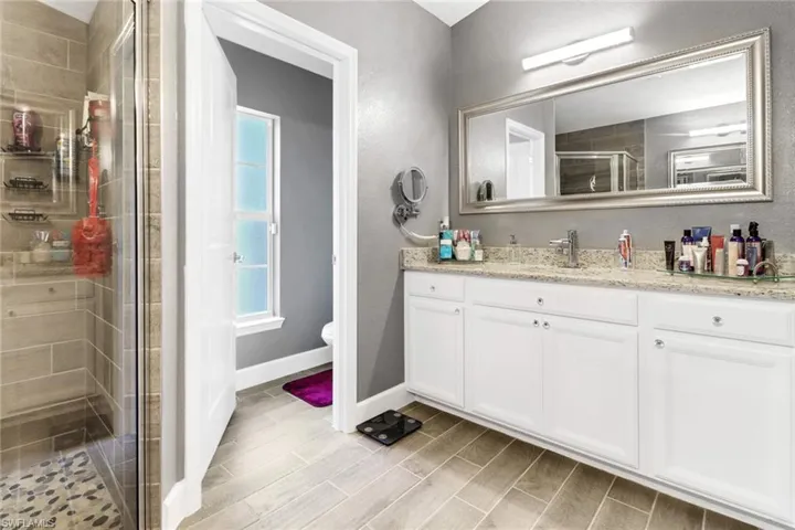 Master bathroom with separate sink area.