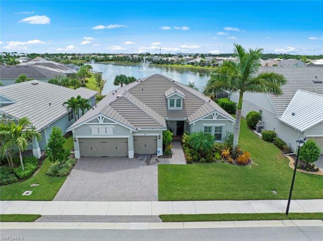 Aerial view of the home w/the lake behind