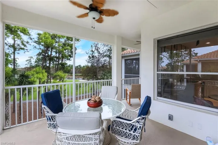 Lanai with fan and view of lake and golf course