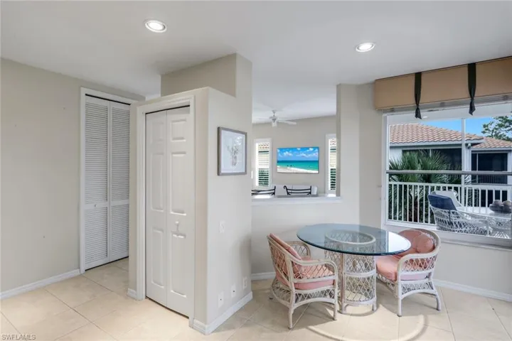 Dining room featuring light tile patterned flooring, ceiling fan, and recessed lighting