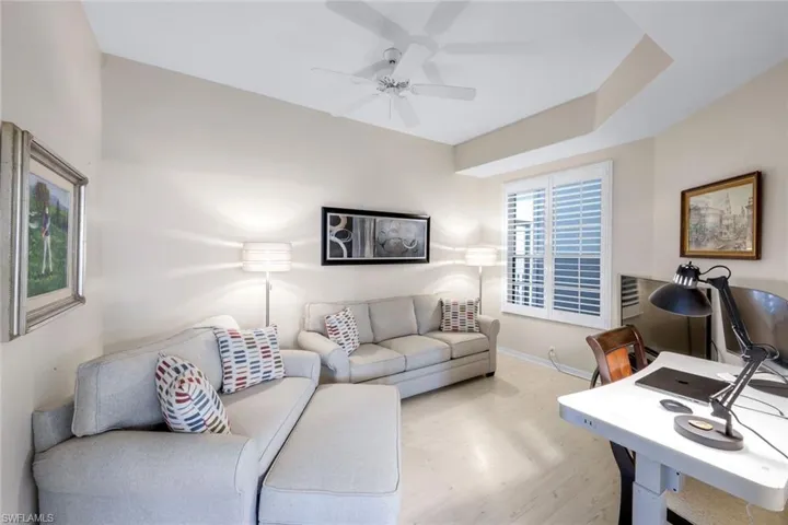 Sofa set not included an office area, ceiling fan, and wood finished floors