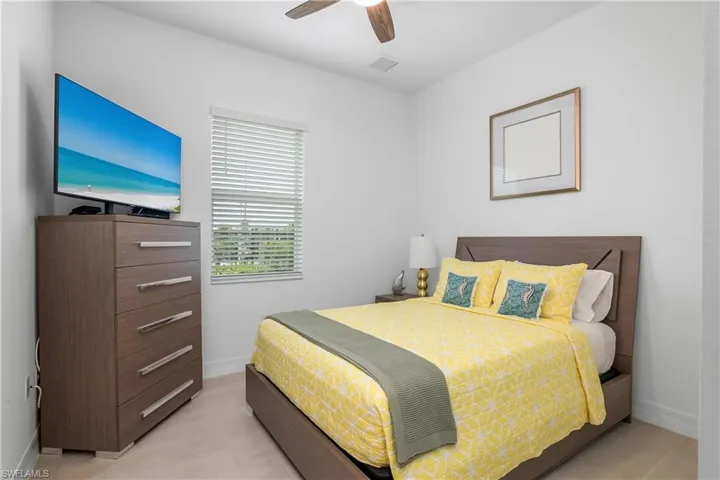 Bedroom featuring baseboards and a ceiling fan
