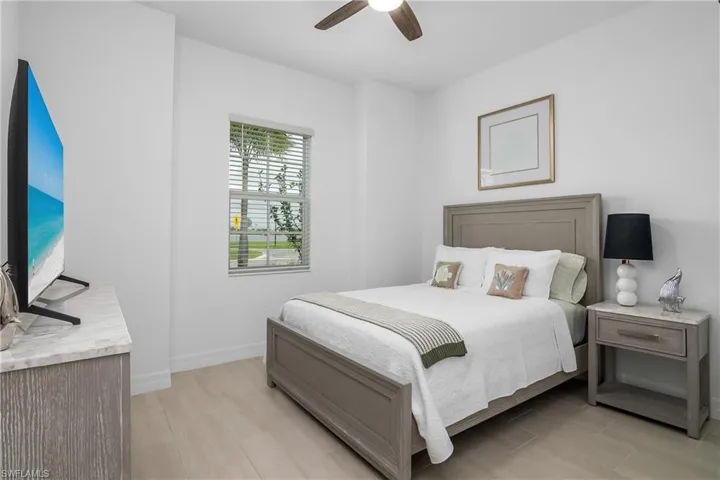 Bedroom featuring light wood-type flooring and ceiling fan