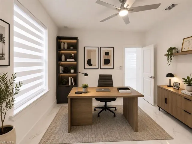 Dedicated office space featuring white walls and marble-look flooring