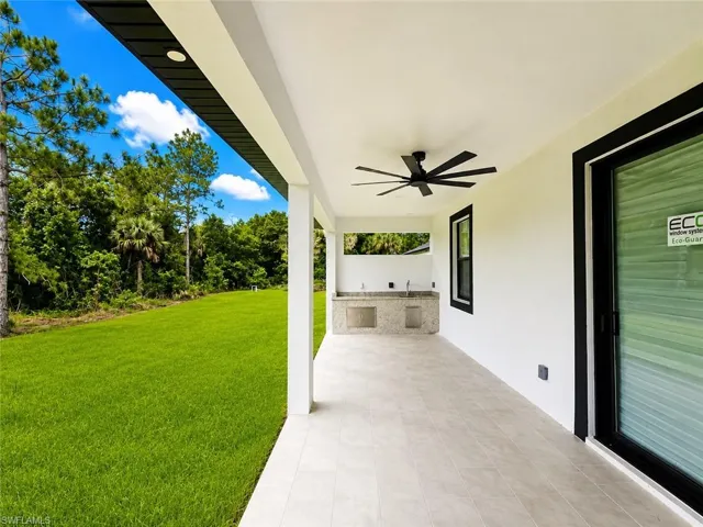 Covered patio featuring a ceiling fan, recessed lighting, and tile flooring