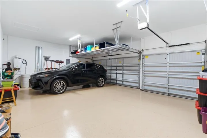 Overhead storage rack and epoxy floor in Garage