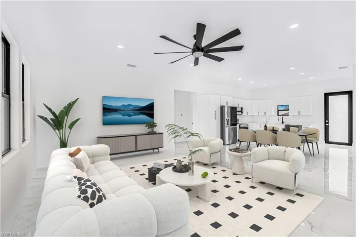 Living room featuring marble finish floor, visible vents, ceiling fan, and recessed lighting