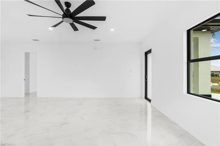 Spare room featuring marble finish floor, visible vents, ceiling fan, and recessed lighting