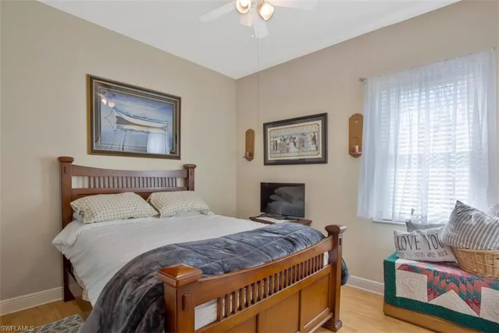 Bedroom featuring ceiling fan and light wood-type flooring