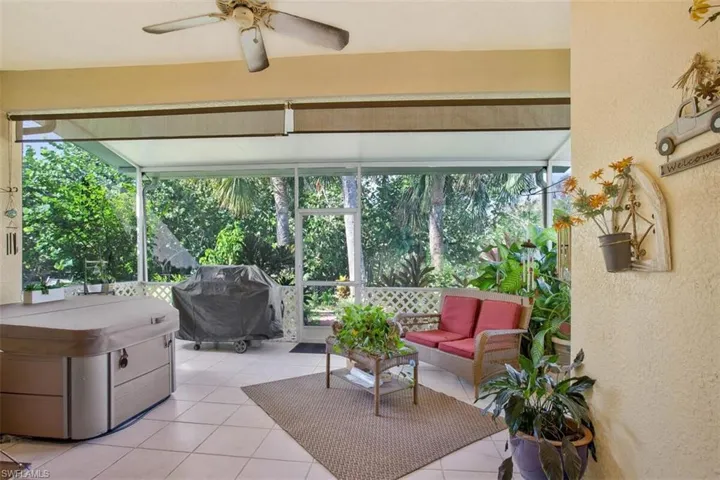 Sunroom featuring ceiling fan