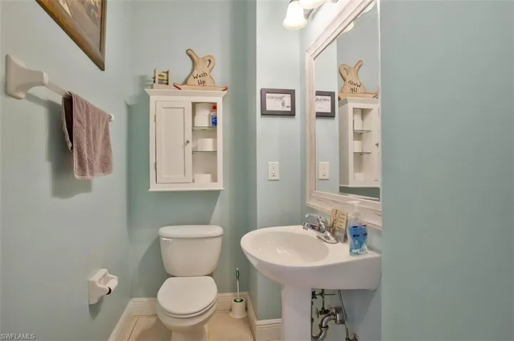 Bathroom featuring toilet and tile patterned flooring