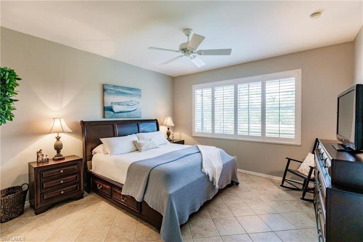 Large main bedroom with water and preserve view