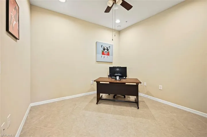 Den or office space with tile flooring