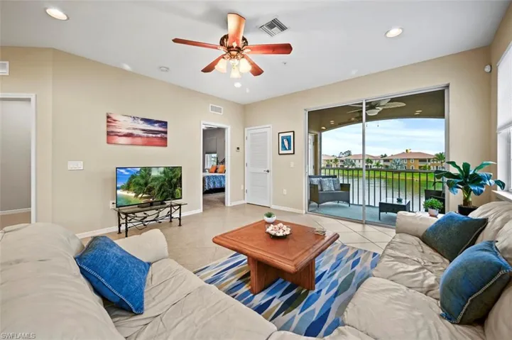 Living room with a lovely view of the balcony with water and fountain feature