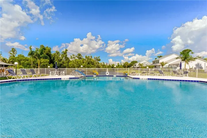 Community pool featuring a patio