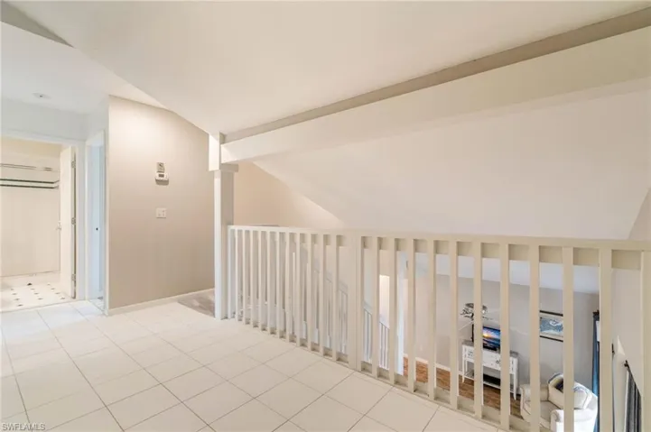 Hall with tile patterned flooring