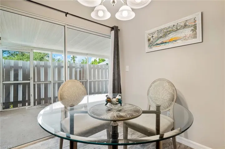 Dining area featuring a chandelier and wood finished floors