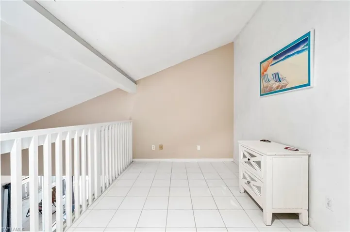 Corridor with light tile patterned floors