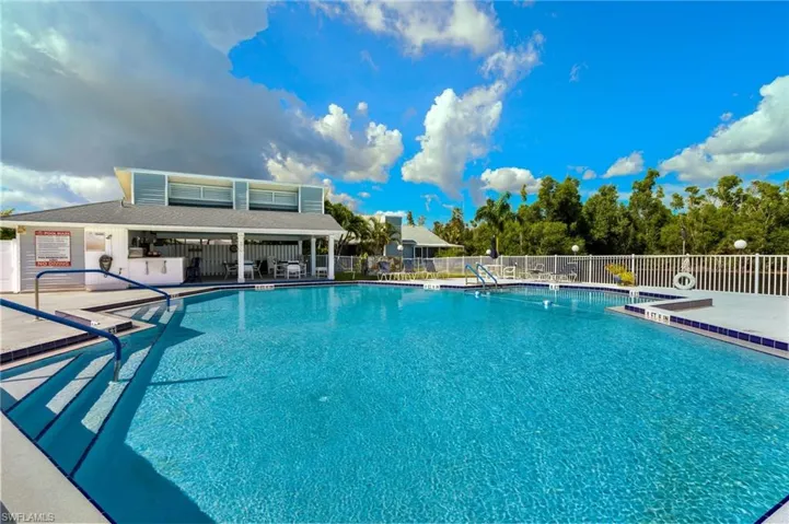 Community pool with a patio area