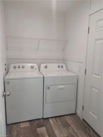 Laundry Room with outside entry door to carport