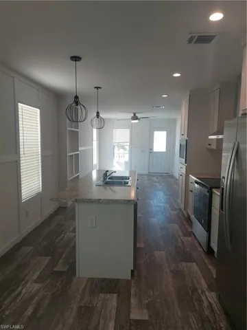 Galley Kitchen with plenty of cabinetry and Island