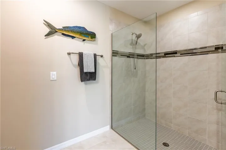 Ensuite primary bathroom with large frameless glass enclosed shower