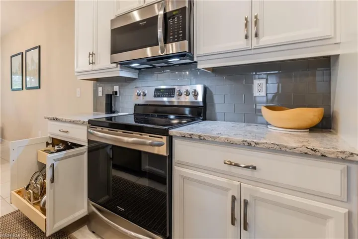 Upgraded cabinets feature pull out drawers for more efficient storage
