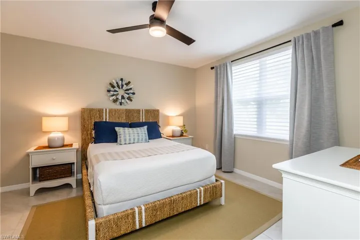 Spacious Primary suite with tiled floors and Modern ceiling fan