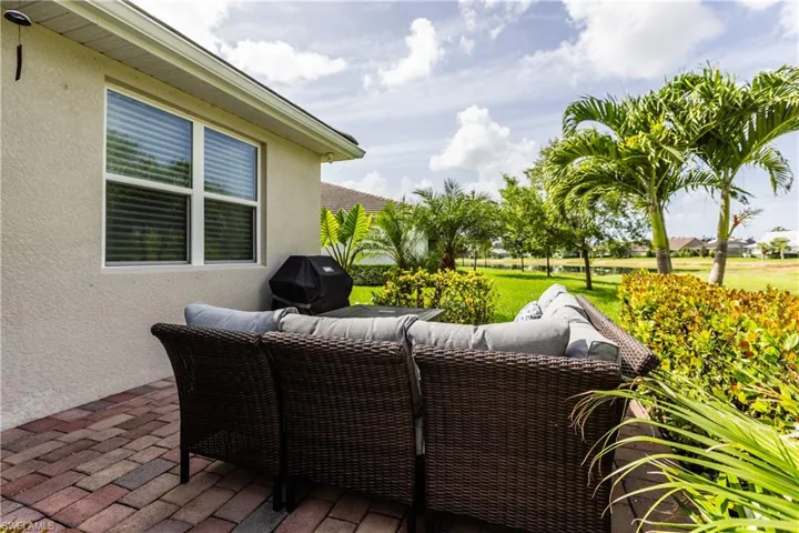 Additional outdoor living space on an extra large paver patio with lake view.  Room in the back for a large pool if desired!