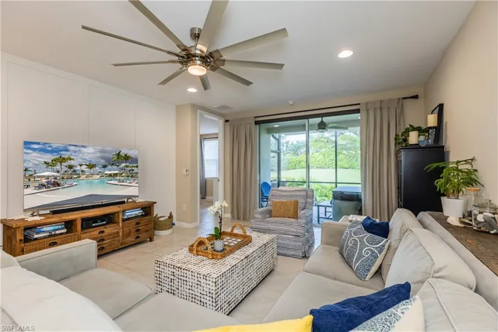 Living space with view of landscaped yard from the lanai