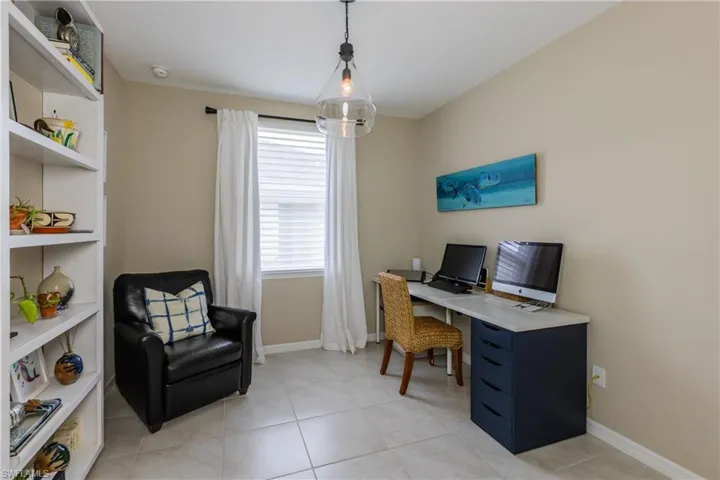 office space with updated lighting and remote control window treatments