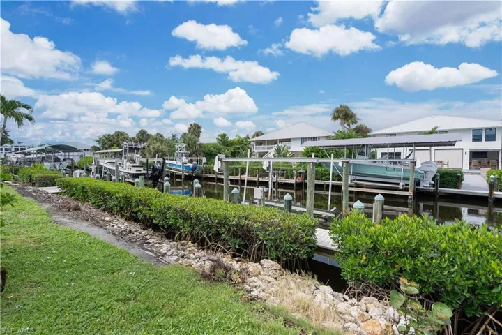 Dock with boat lift and a water view